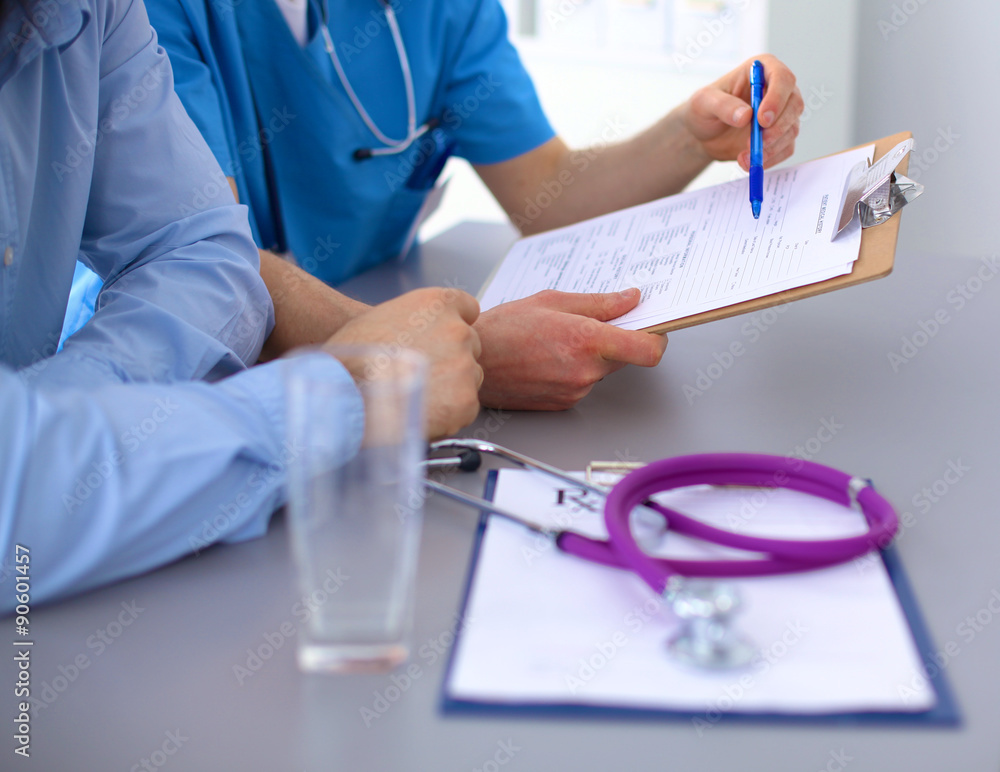 close up of patient and doctor taking notes close up of patient and doctor taking notes