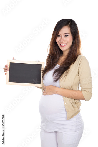 Beautiful asian pregnat woman holding a blank chalkboard