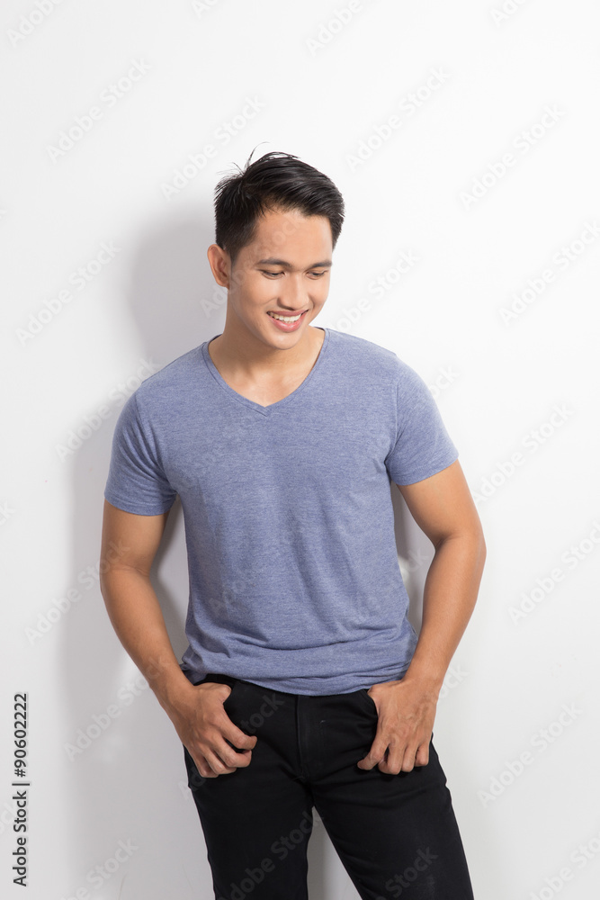 happy Young asian man posing hands on the waist, smile to the ca happy Young asian man posing hands on the waist, smile to the ca