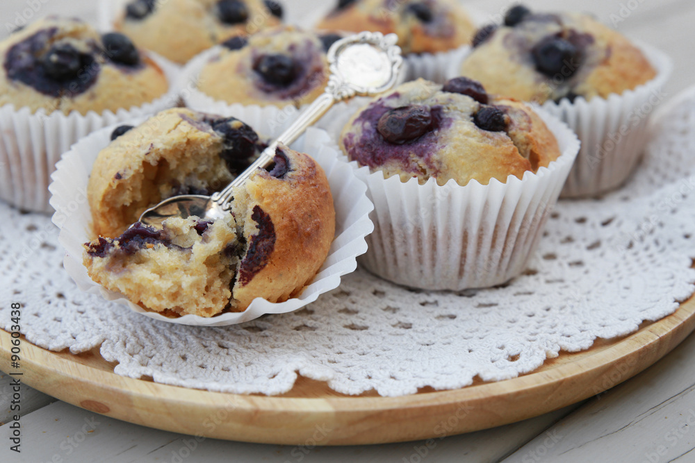 Homemade wholemeal coconut blueberry muffins with silver spoon