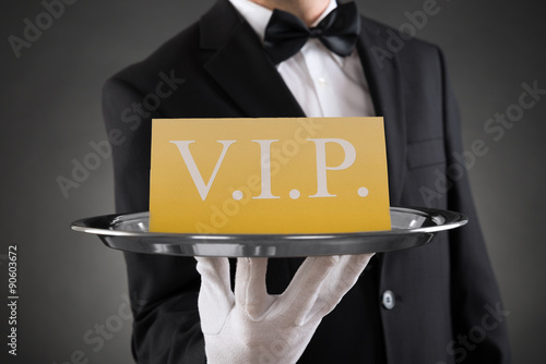 Waiter Showing Vip Text On Banner