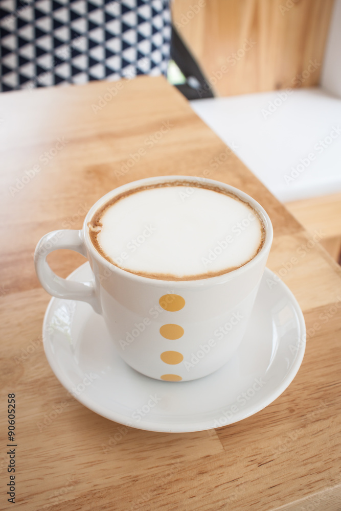 capucino coffee on wood table