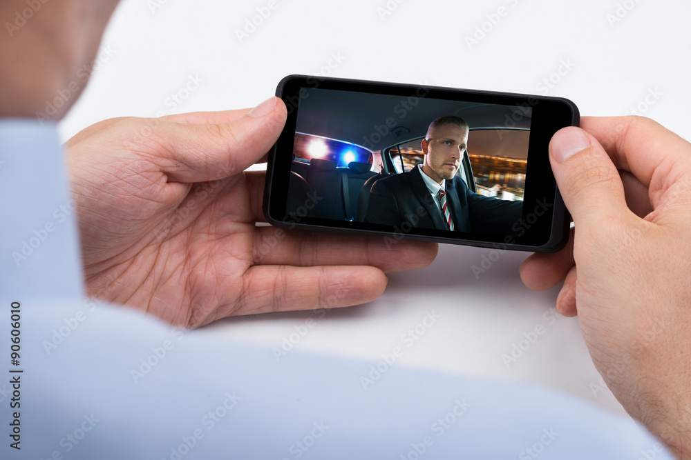 Person Watching Video On Mobile Phone