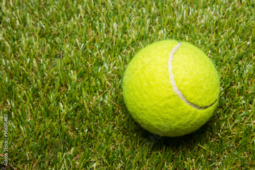 tennis ball on tennis grass court