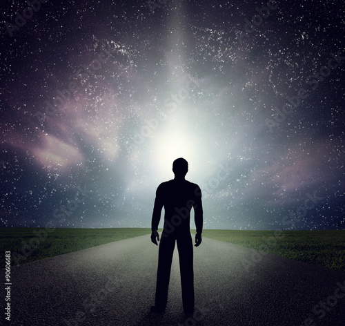 Man standing on the road looking at stars  sky  universe. Dream  adventure.