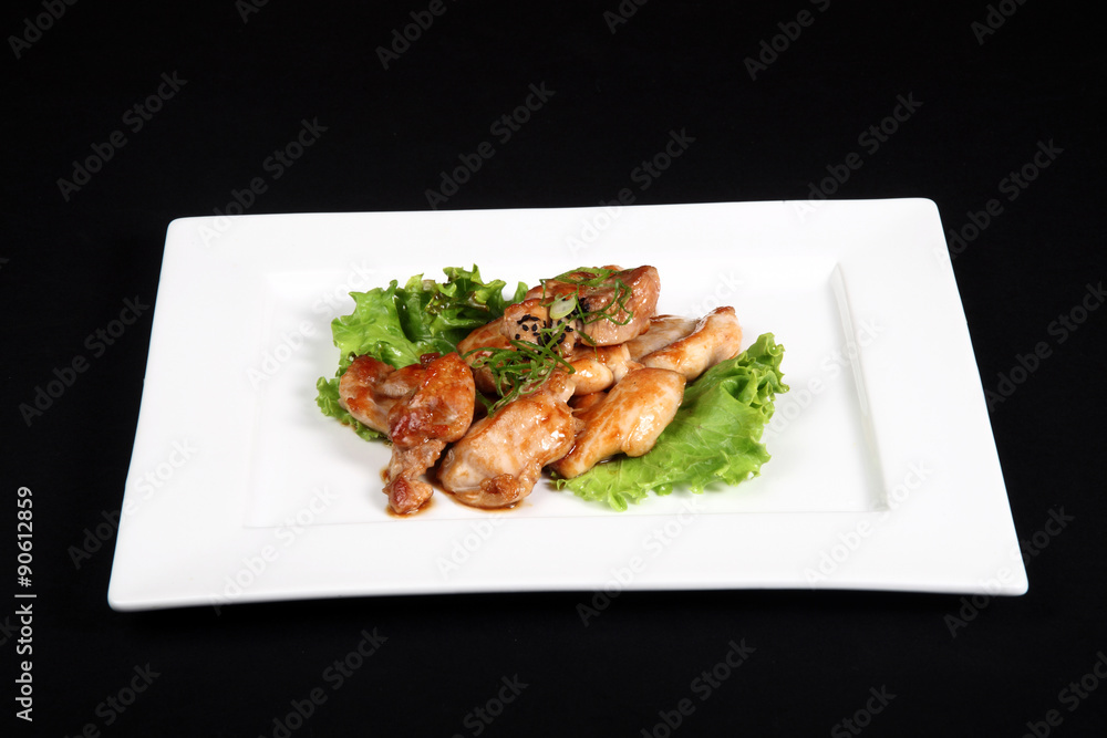 grilled chicken with vegetables in white plate