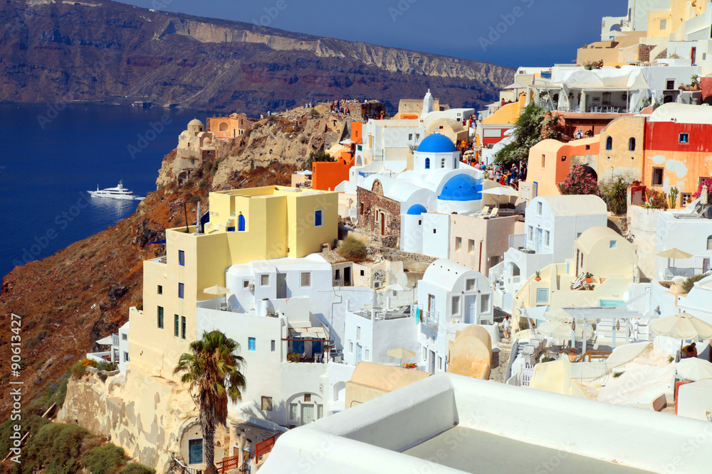 Beautiful view with colorful houses in  village of Oia, Santorin