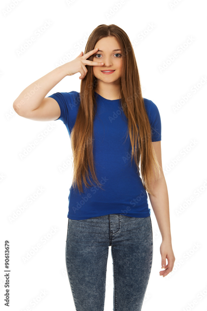 Happy teenager with victory sign on eye. Happy teenager with victory sign on eye.