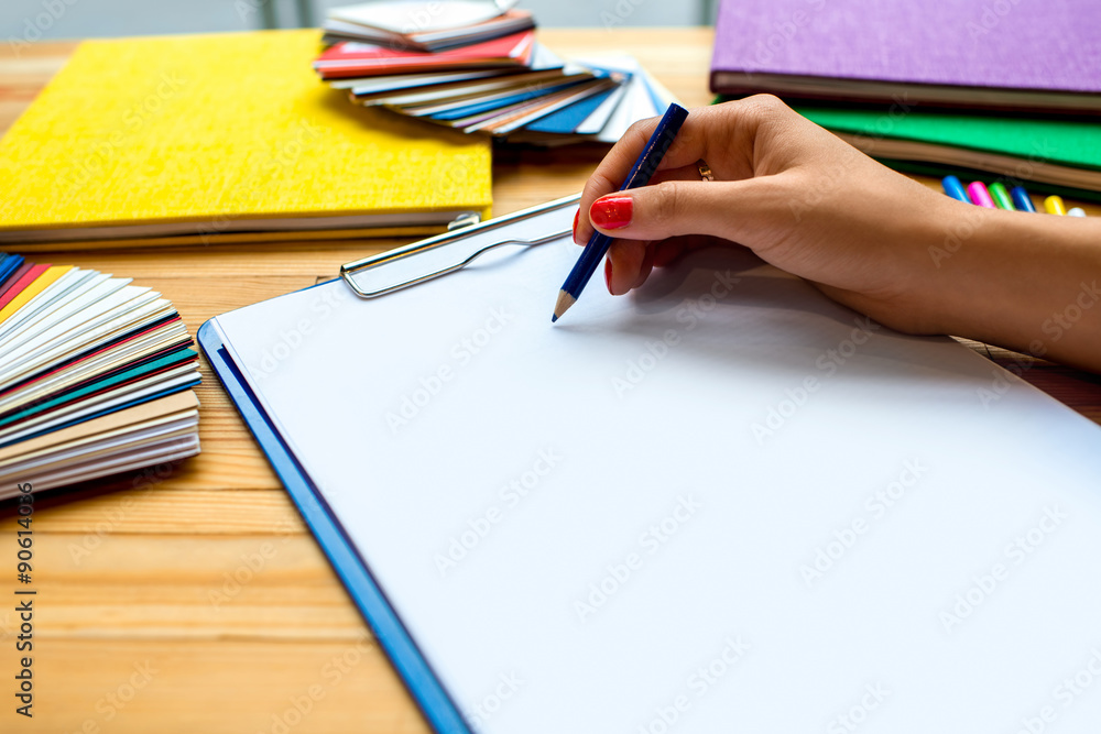 Writing with color pencil on the white sheet of paper Writing with color pencil on the white sheet of paper