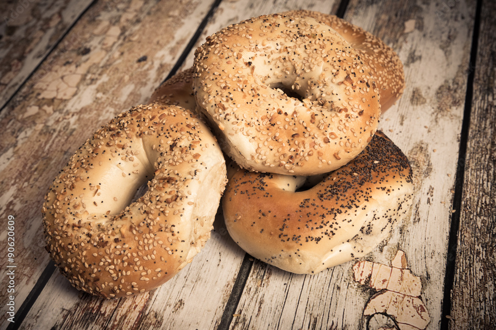 Variety of traditional New York style bagels with seeds Variety of traditional New York style bagels with seeds