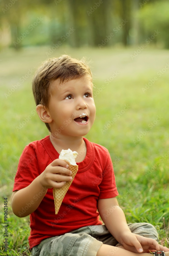 Cute little boy eating ice cream