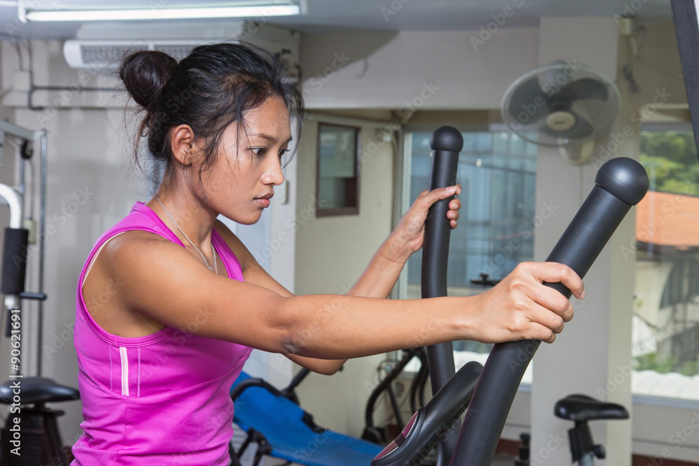 Fototapeta premium woman exercises in a gym