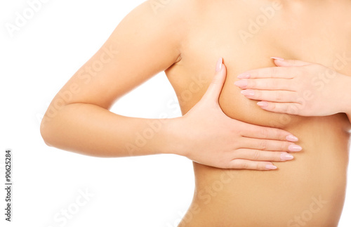 Woman examining breast. © Piotr Marcinski