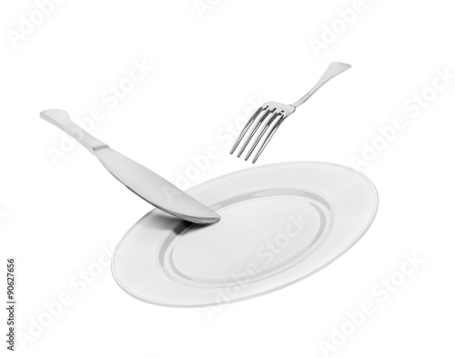falling empty white plate, knife and fork isolated on white back