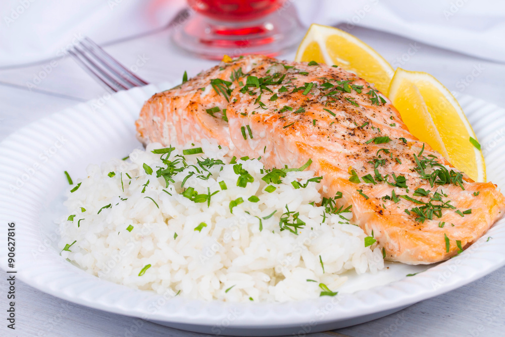 Steamed salmon with fresh herbs and lemon. Rice as a garnish Steamed salmon with fresh herbs and lemon. Rice as a garnish