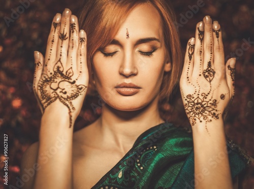 Woman with traditional mehndi henna ornament photo