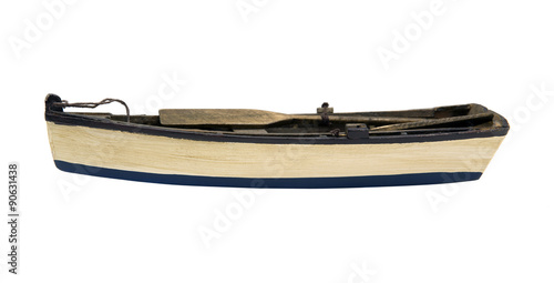 Isolated wooden boat with paddles