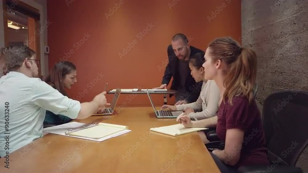 Man leading a small business meeting
Man leading a small business meeting