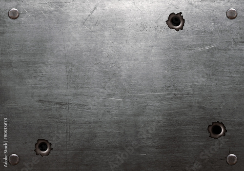 Metal plate with bullet holes