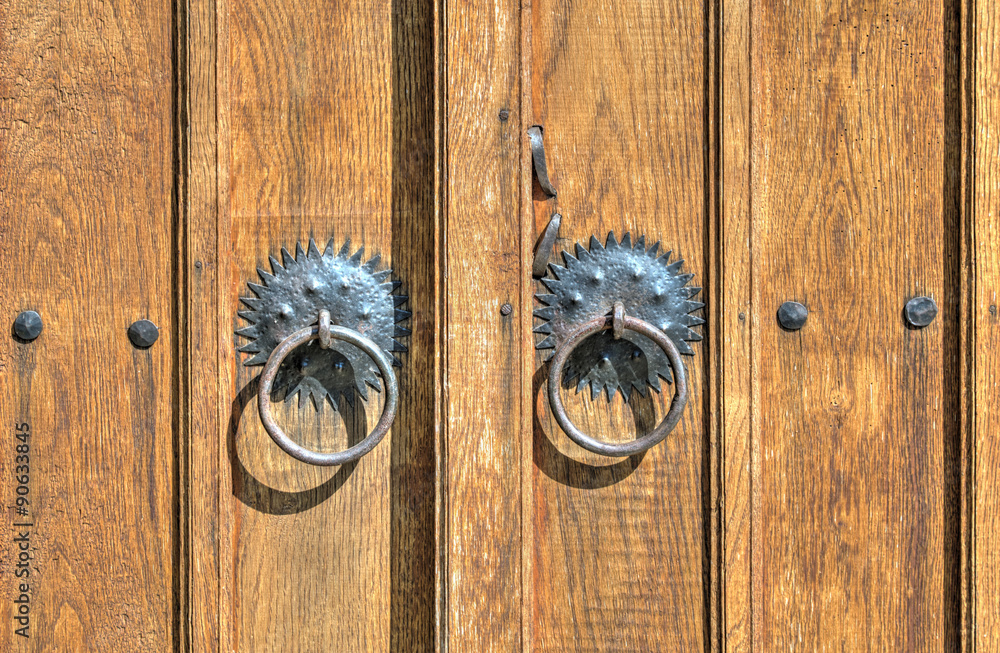 Wooden door with metal ornaments Wooden door with metal ornaments