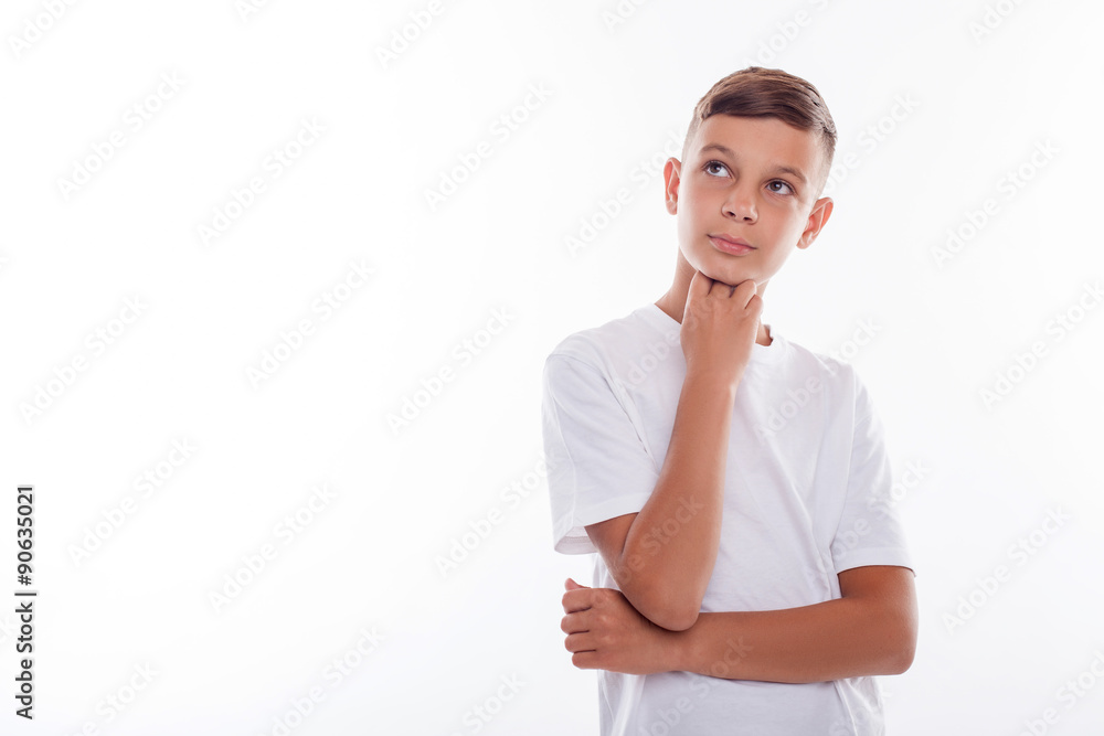 Cute male teenager is thinking about something Cute male teenager is thinking about something
