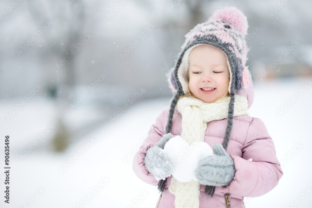 Funny little girl having fun in winter park Funny little girl having fun in winter park