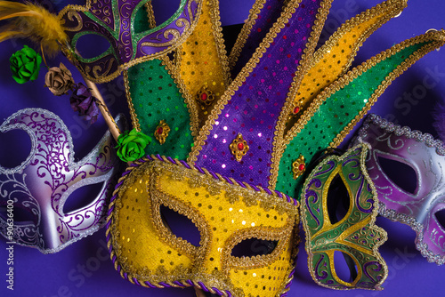 Mardi Gras or carnival mask on purple background