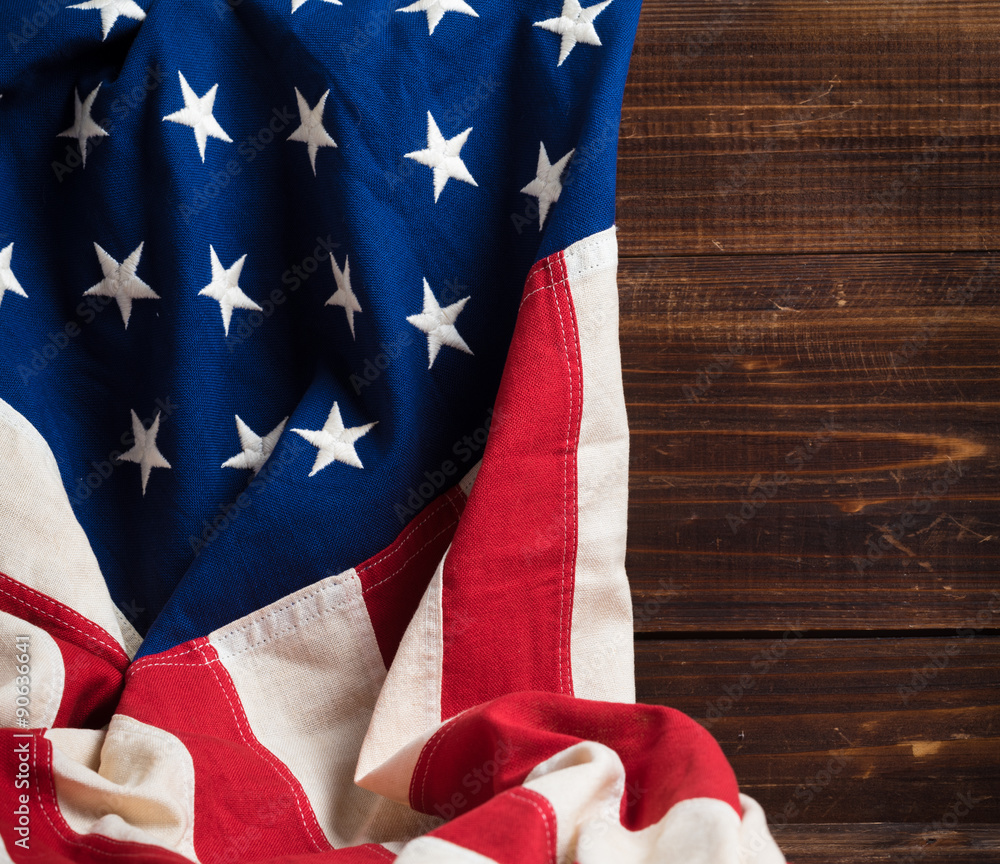 Old American Flag on wooden plank background