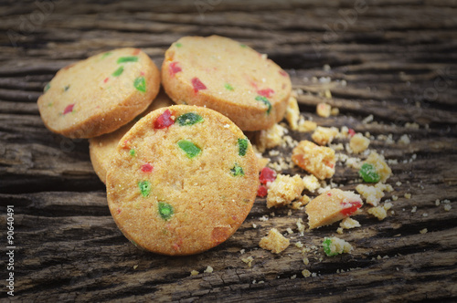Mixed fruits cookies on old wooden background