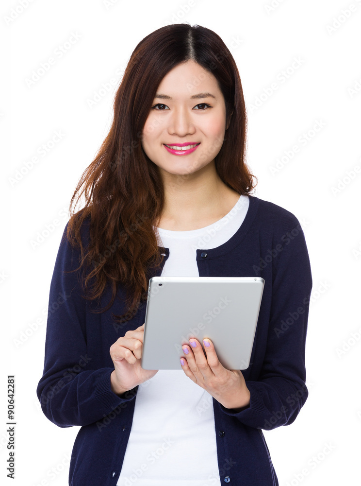 Asian young woman use of the tablet pc Asian young woman use of the tablet pc