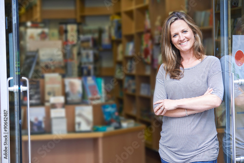 Portrait Of Female Bookshop Owner Outside Store photo