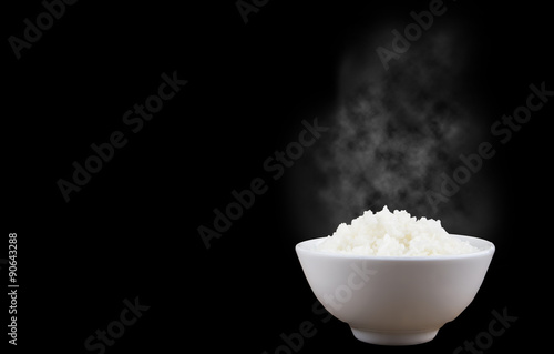 Isolated of Hot Steamed Rice in a White Bowl on dark background