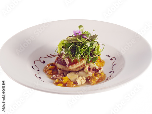 grilled goose liver with artichoke, mango and walnut salad