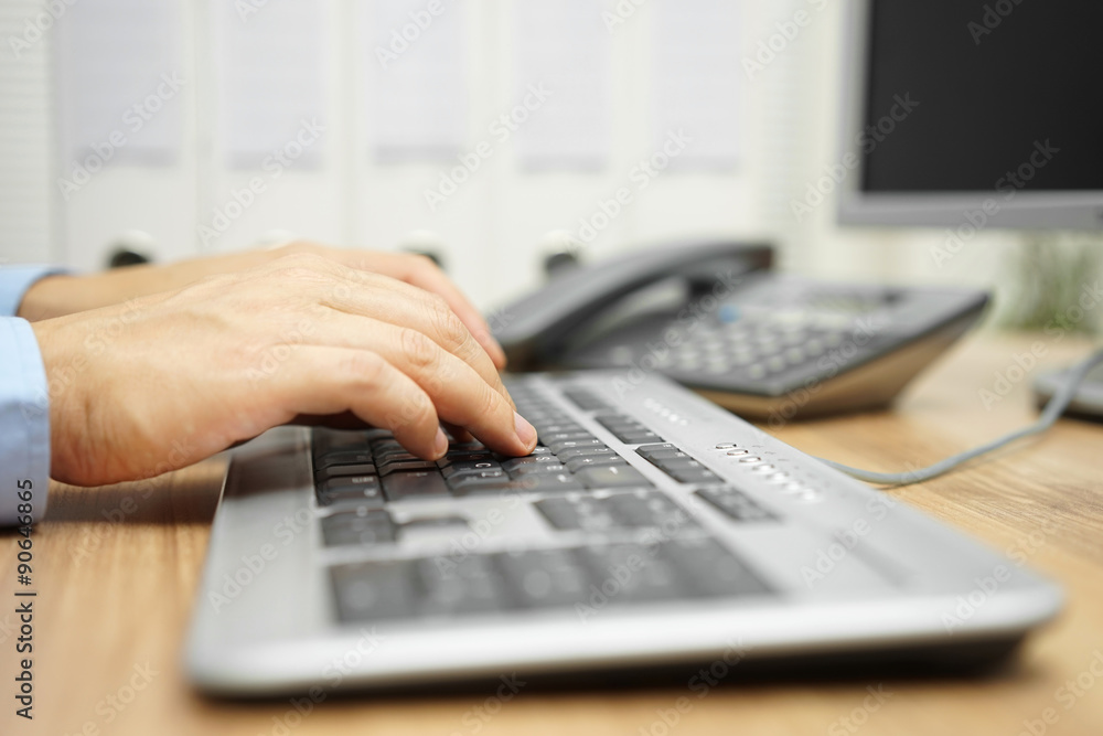 businessman is typing on computer keyboard on his office desk w businessman is typing on computer keyboard on his office desk w