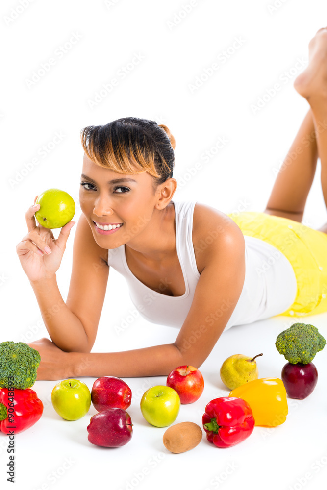 Asian woman eating healthy fruit Asian woman eating healthy fruit