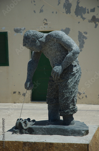 Statua del pescatore di polipi, Fuerteventura, Puerto de la cruz photo