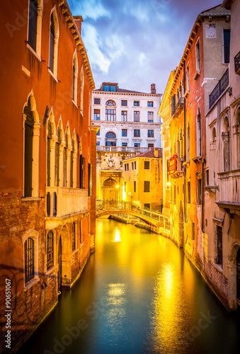 Narrow canal in Venice in the evening