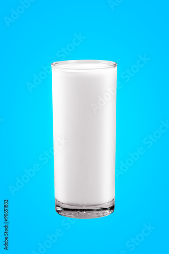 Glass of milk isolated on Blue background