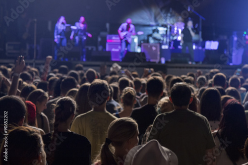 Defocused crowd and performers on music festival