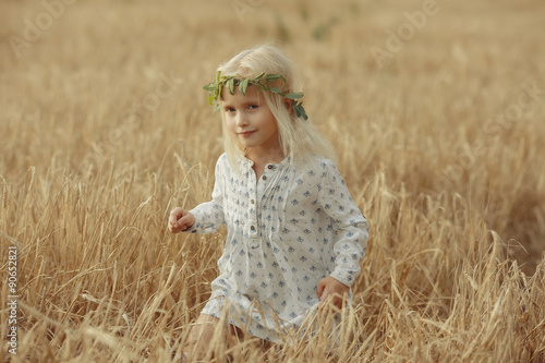 cheerful little girl on the nature of soft light portrait