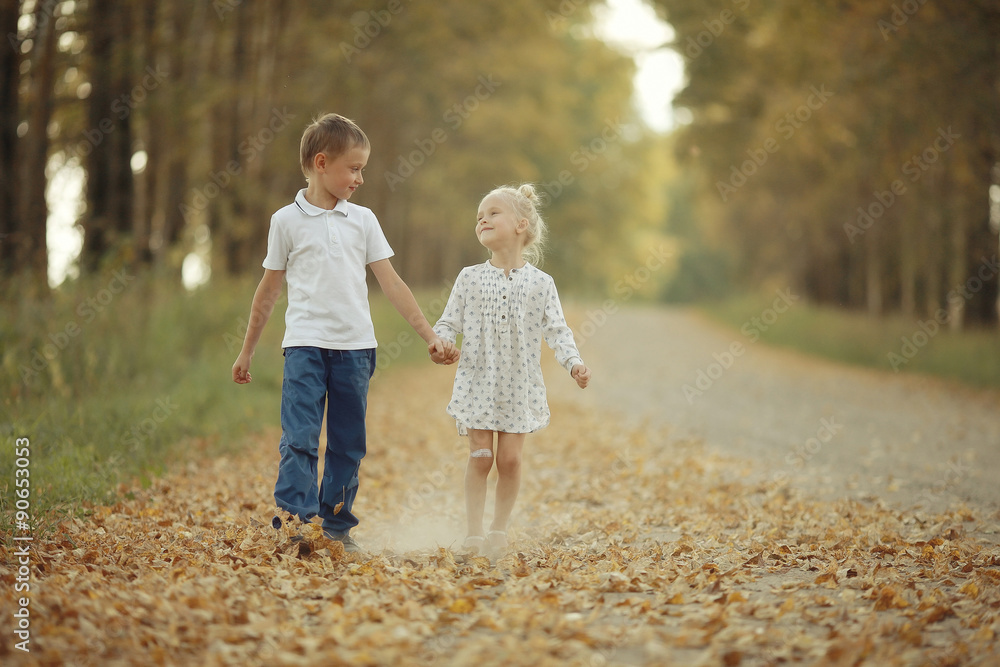 Fototapeta premium Brother and sister Autumn road