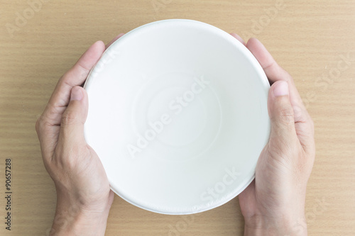 man hand with empty bowl