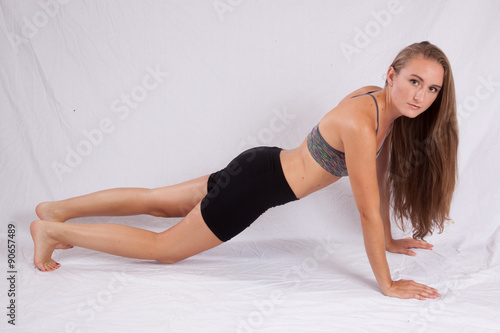 Pretty, long haired woman exercising