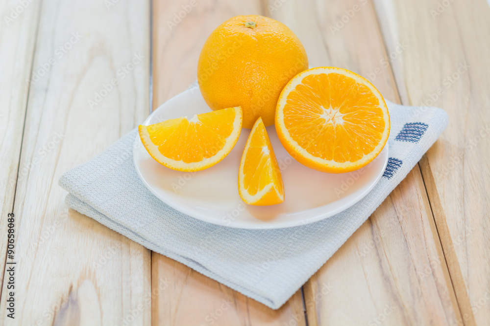Fresh slices orange fruit with dish Fresh slices orange fruit with dish