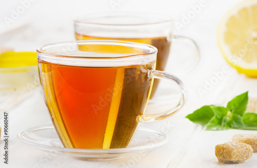 Hot tea with mint and lemon slices.
