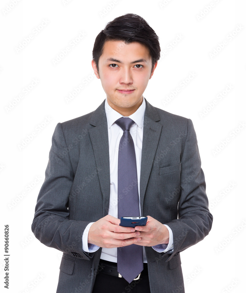 Asian Young businessman use of the cellphone Asian Young businessman use of the cellphone