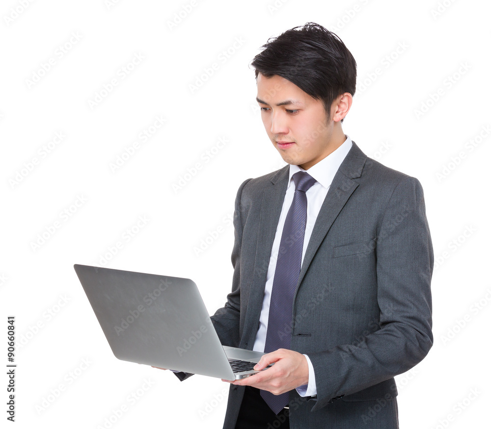 Young businessmanread on the notebook computer Young businessmanread on the notebook computer
