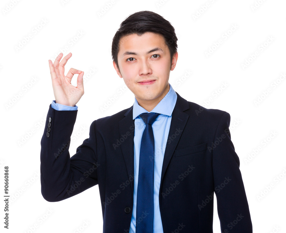 Asian young businessman with ok sign gesture Asian young businessman with ok sign gesture
