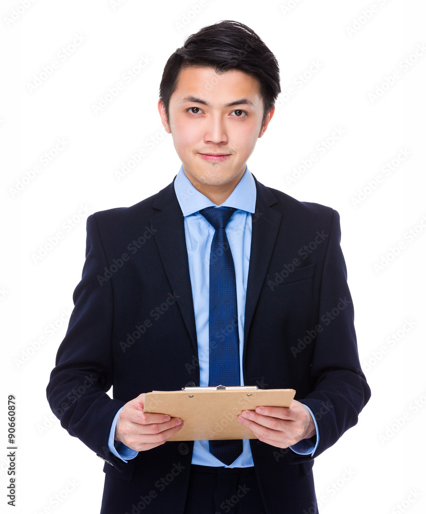 Asian businessman hold with clipboard Asian businessman hold with clipboard