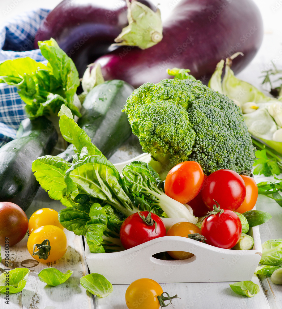 Fresh organic vegetables on white wooden table. Fresh organic vegetables on white wooden table.